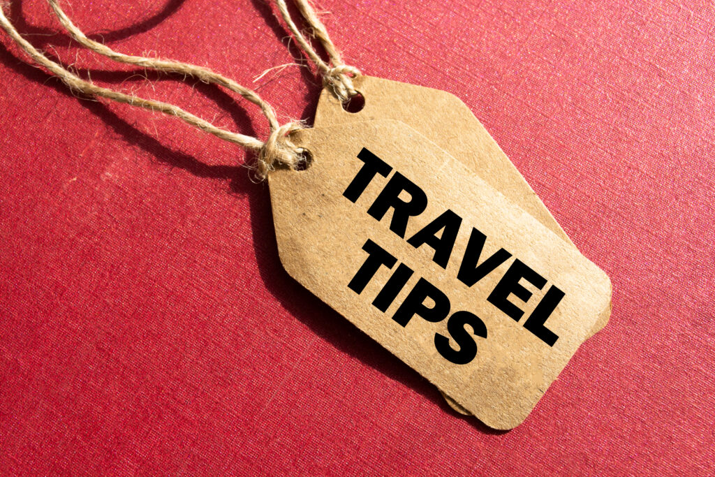 Planning a Trip to Melbourne. Travel tips. Inscription travel tips on blank tags on wooden table