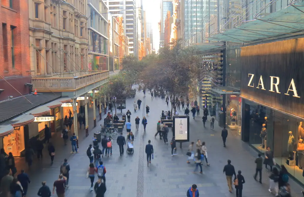 Unidentified people visit Pitt street mall. Pitt street mall is a prehistorian street with department stores and shops in downtown Sydney.