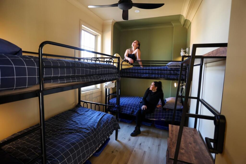 Travellers in the dormitory getting ready before they go out and explore in Coogee