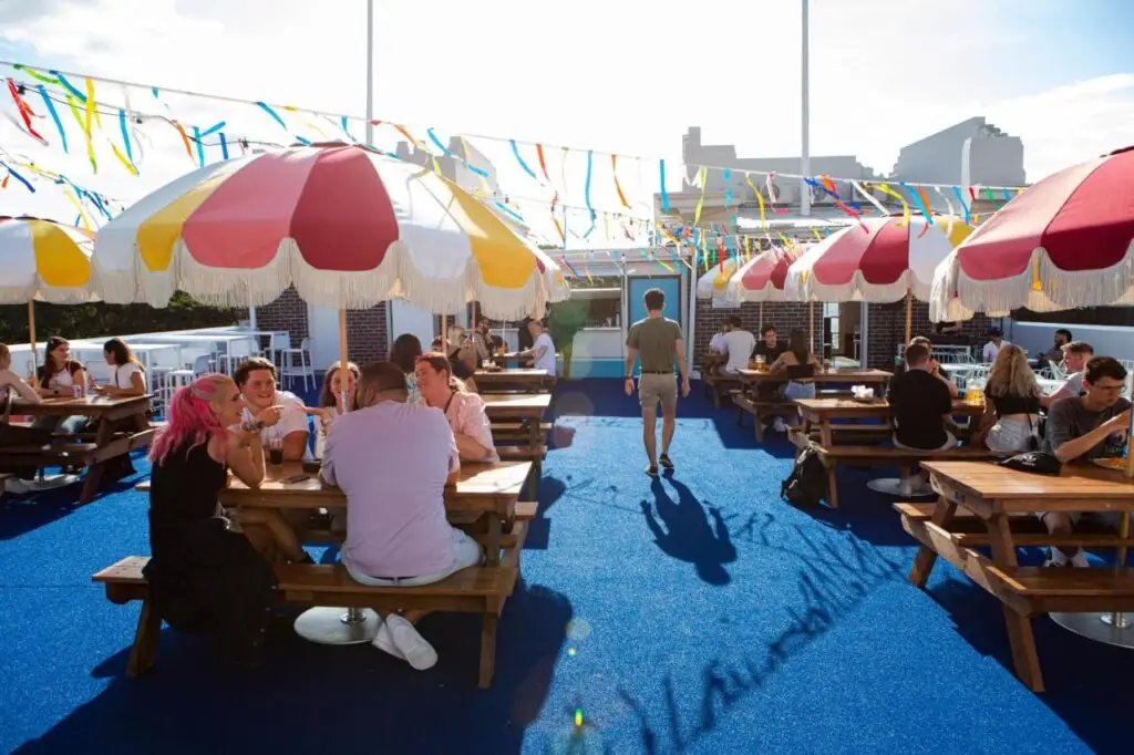 A rooftop where travellers and guests socialise on a warm Australian day at The Lansdowne Hotel