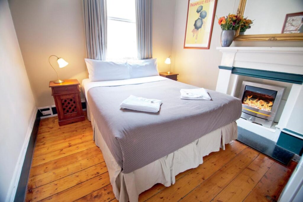 A super cosy affordable room with fireplace and comfortable bed at The Nunnery Accommodation