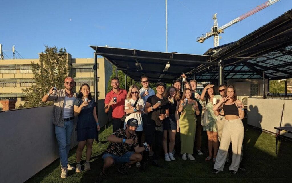 A bunch of travellers socialising in the rooftop out door area at The Village Glebe