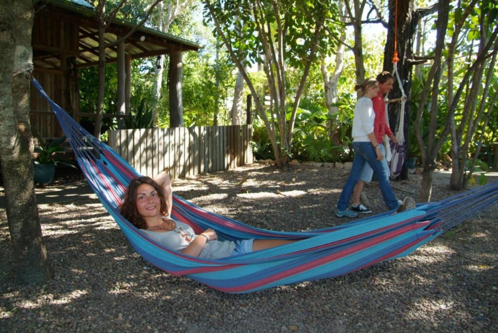 Traveller on a hammock in the garden area at Woolshed Eco Lodge