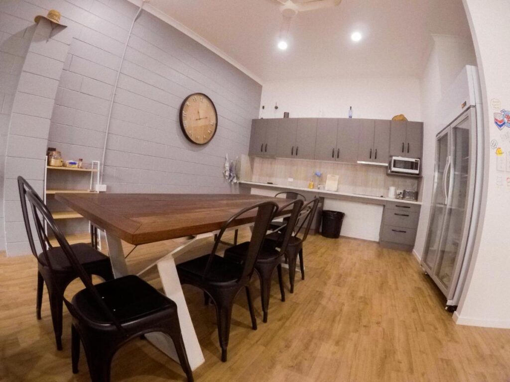 The shared dining area where trevellers sit and socialise after cooking a meal at Bunk Inn Hostel