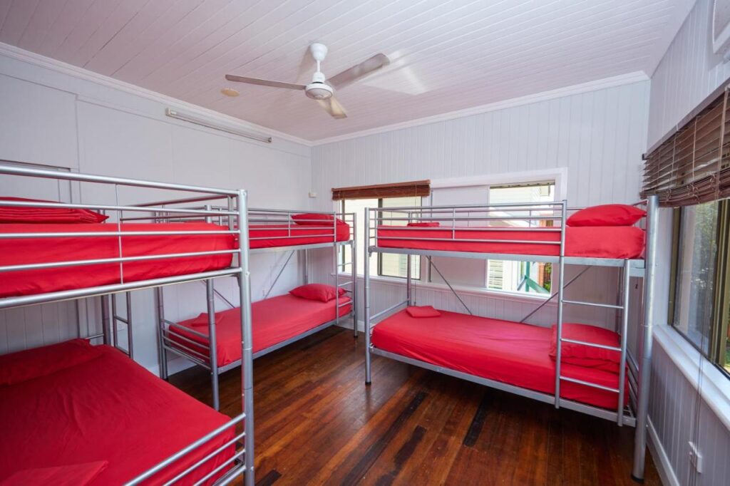 A mixed six bed dormitory for guests at Cairns City Backpackers Hostel