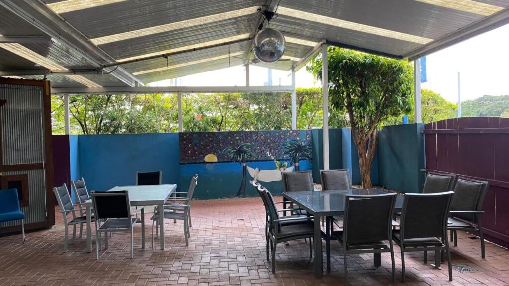 An outdoor entertainment and dining area where gests entertain at Homely Inn Hostel