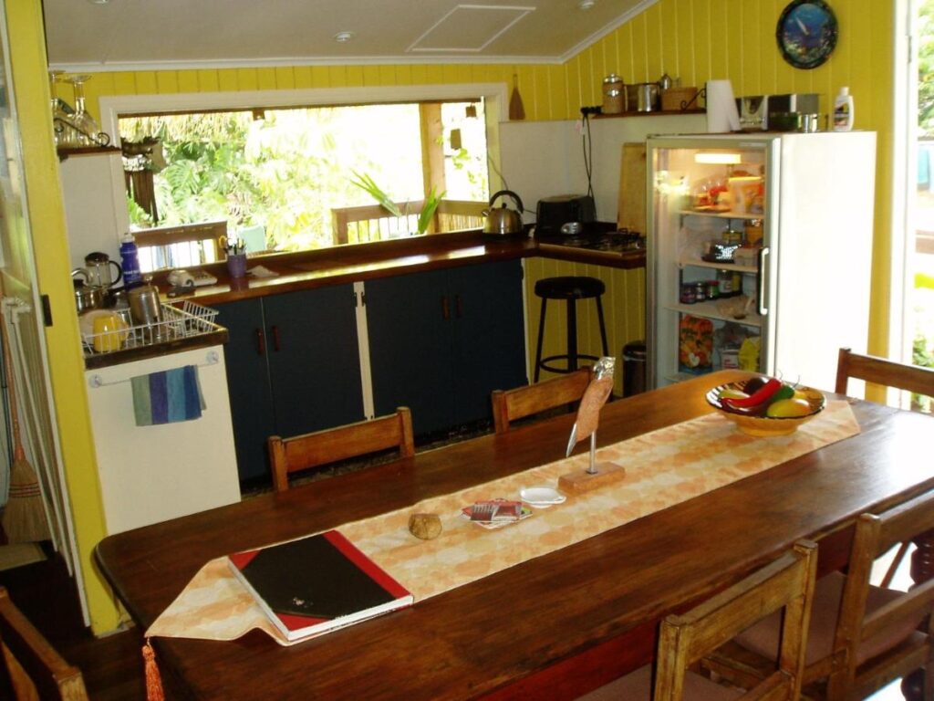 Kitched with bar and dining table at Mango Tourist Hostel