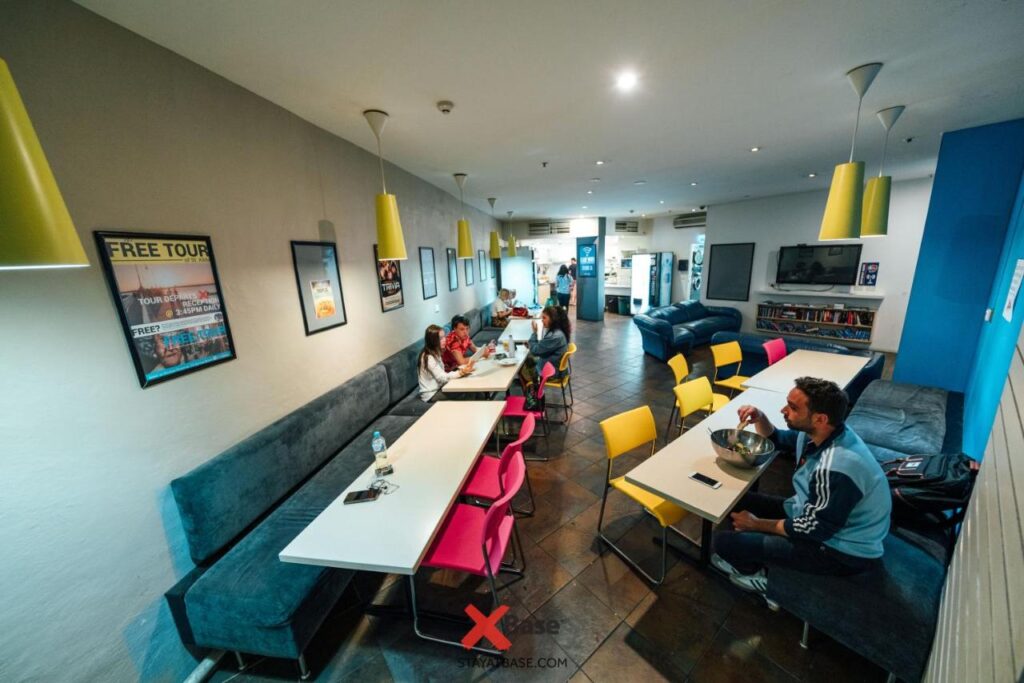 A large dining area for guests to enjoy a meal or relax with new friends at Nomads St Kilda